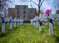 Crosses laid out on a lawn near the Camilla Care Community, a long term care home in Mississauga, Ont., are photographed on April 13 2020. Fifty residents of the facility have died of the coronavirus.