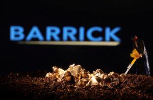 A small toy figure and gold imitation are seen in front of the Barrick logo in this illustration taken November 19, 2021