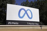 FILE - Facebook's Meta logo sign is seen at the company headquarters in Menlo Park, Calif. on Oct. 28, 2021. According to a report released Thursday, June 9, 2022, Facebook and parent company Meta once again failed to detect blatant, violent hate speech in advertisements submitted to the platform by the nonprofit groups Global Witness and Foxglove. (AP Photo/Tony Avelar, File)