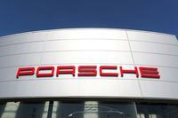 FILE PHOTO: A logo of Porsche is seen outside a Porsche car dealer, amid the coronavirus disease (COVID-19) outbreak in Brussels, Belgium May 28, 2020. REUTERS/Yves Herman/File Photo