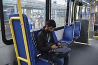 Kitchener, Ontario (August 25, 2023) - After handing out a few resumes at Conestoga Mall, Kartik Purani heads home on the bus in Kitchener, ON. Alicia Wynter/Globe and Mail
