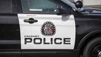 Police vehicles are shown at Calgary Police Service headquarterson April 9, 2020. Police say a 48-year-old Calgary man has been charged after a woman was found dead in a city park. THE CANADIAN PRESS/Jeff McIntosh