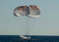 JACKSONVILLE, FLORIDA, OCTOBER 14: In this handout image provided by NASA, the SpaceX Crew Dragon Freedom spacecraft is seen as it lands with NASA astronauts Kjell Lindgren, Robert Hines, Jessica Watkins, and ESA (European Space Agency) astronaut Samantha Cristoforetti aboard, in the Atlantic Ocean on October 14, 2022, off the coast of Jacksonville, Florida. Lindgren, Hines, Watkins, and Cristoforetti are returning after 170 days in space as part of Expeditions 67 and 68 aboard the International Space Station. (Photo by Bill Ingalls/NASA via Getty Images)