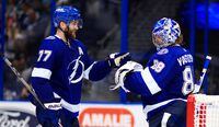 TAMPA, FLORIDA - JUNE 05: Victor Hedman #77 and Andrei Vasilevskiy #88 of the Tampa Bay Lightning celebrate wining Game Four of the Second Round of the 2021 Stanley Cup Playoffs against the Carolina Hurricanes at Amalie Arena on June 05, 2021 in Tampa, Florida. (Photo by Mike Ehrmann/Getty Images)