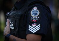 A Surrey police department logo is seen on an officer's uniform in Surrey, B.C., on Wednesday, August 31, 2022.&nbsp;The chief of the Surrey Police Service is calling for an independent audit of the city's costings for its policing transition, saying he's concerned they've been "inflated and mischaracterized" to target the force. THE CANADIAN PRESS/Darryl Dyck