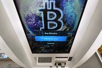 The Bitcoin logo appears on the display screen of a cryptocurrency ATM in Salem, N.H., Feb. 9, 2021.