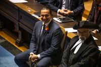 Manitoba Premier Wab Kinew is seen in the legislative assembly at the Manitoba Legislative Building in Winnipeg on Tuesday, Nov. 21, 2023. Kinew says he plans to tighten the government's belt in order to deal with the province's latest deficit projection. THE CANADIAN PRESS/Aaron Vincent Elkaim