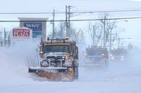 Snow plows clear the roads following a winter storm that hit the Buffalo region in Lancaster, New York, U.S., December 25, 2022.  REUTERS/Brendan McDermid