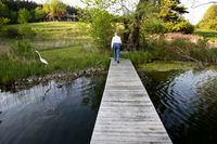 May 23, 2007.Jane Glassco walks on the pier on a kettle lake on some of the 300 acres of her woodland and farmland that she is donating to preserve the Ontario Greenbelt, near Schomberg, May 23, 2007.  (J.P. Moczulski/The Globe and Mail)