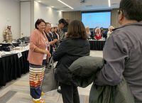 Newly elected Grand Chief Cathy Merrick, second left, of the Assembly of Manitoba Chiefs greets people shortly after First Nations chiefs in the province voted her as the next leader of the advocacy organization in Winnipeg on Wednesday, Oct. 26, 2022. Chiefs in Manitoba have elected the first female leader of one of the largest First Nations advocacy groups in the province. THE CANADIAN PRESS/Brittany Hobson 