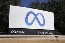 FILE - Facebook's Meta logo sign is seen at the company headquarters in Menlo Park, Calif. on Oct. 28, 2021. A federal judge has sided with Facebook parent Meta and cleared the way for the company to buy virtual reality startup Within Unlimited, the maker of the popular fitness app Supernatural. Federal antitrust regulators had sought to block the acquisition on the grounds that it would hurt competition in the emerging virtual reality market. But U.S. District Judge Edward Davila denied the Federal Trade Commission's request for a preliminary injunction against the deal. (AP Photo/Tony Avelar, File)