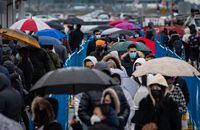 Hundreds of people wait in line to enter McArthur Glen Designer Outlet, due to the shopping centre being at capacity, on Boxing Day in Richmond, B.C., on Saturday, December 26, 2020. THE CANADIAN PRESS/Darryl Dyck