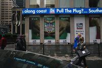 FILE -- An election coverage advertisement outside the Fox News headquarters in New York, Oct. 28, 2020. In February, Smartmatic sued Rupert MurdochÕs Fox Corporation and several Fox anchors on similar grounds. (Celeste Sloman/The New York Times)
