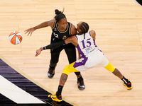 LAS VEGAS, NEVADA - MAY 21:  Chelsea Gray #12 of the Las Vegas Aces is guarded by Brittney Sykes #15 of the Los Angeles Sparks during their game at Michelob ULTRA Arena on May 21, 2021 in Las Vegas, Nevada. NOTE TO USER: User expressly acknowledges and agrees that, by downloading and or using this photograph, User is consenting to the terms and conditions of the Getty Images License Agreement.  (Photo by Ethan Miller/Getty Images)