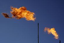 Flares burn off methane and other hydrocarbons at an oil and gas facility in Lenorah, Texas, Friday, Oct. 15, 2021. THE CANADIAN PRESS/AP-David Goldman