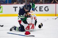 Nov 1, 2022; Vancouver, British Columbia, CAN; Vancouver Canucks defenseman Luke Schenn (2) fights with New Jersey Devils forward Miles Wood (44) in the second period at Rogers Arena. Mandatory Credit: Bob Frid-USA TODAY Sports