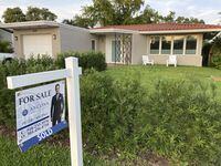 FILE - A home with a "Sold" sign is shown, Sunday, May 2, 2021, in Surfside, Fla. Average long-term U.S. mortgage rates inched up this week following last week’s mammoth jump, the biggest in 35 years. Mortgage buyer Freddie Mac reported Thursday, June 23, 2022, that the 30-year rate ticked up to 5.81% this week, from last week’s 5.78%. (AP Photo/Wilfredo Lee, File)