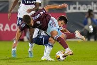 Colorado Rapids forward Diego Rubio (11) tangles with Vancouver Whitecaps midfielder Andrés Cubas (20) during the second half of an MLS soccer match Wednesday, Sept. 27, 2023, in Commerce City, Colo. (AP Photo/Jack Dempsey)