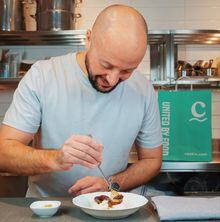 Patrick Kriss, chef and founder of Alo Group, prepares food.