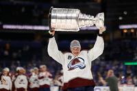 Jun 26, 2022; Tampa, Florida, USA; Colorado Avalanche defenseman Cale Makar (8) celebrates with the Stanley Cup after the game against the Tampa Bay Lightning in game six of the 2022 Stanley Cup Final at Amalie Arena. Mandatory Credit: Geoff Burke-USA TODAY Sports