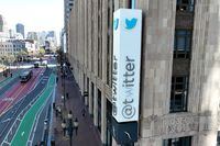 SAN FRANCISCO, CALIFORNIA - APRIL 10: In an aerial view, a modified company sign is posted on the exterior of the Twitter headquarters on April 10, 2023 in San Francisco, California. Twitter CEO Elon Musk had the sign in front of Twitter headquarters modified by painting over the letter "W" in the Twitter name. (Photo by Justin Sullivan/Getty Images)