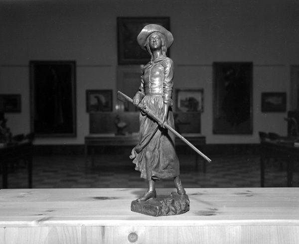 Exhibition of artwork at the Musée Provincial in Quebec City: statuette of Madeleine de Verchères by Louis-Philippe Hébert, December 10, 1942. In 1692, Madeleine de Verchères, then only 14 years of age, alone in Fort de Verchères in what was then New France, with her two young brothers, an old servant, and two soldiers, took command and defended the post successfully for eight days against a war-party of Iroquois. In the early 20th century, the Governor General of Canada, Lord Grey, recommended a commemoration project to honour the role Madeleine de Verchères played in defending Fort Verchères. After seeing the statuette of Madeleine de Verchères created by Louis-Philippe Hébert in 1910, the Governor General proposed reproducing the statuette on a larger scale and placing it on the headland of Verchères, facing the St. Lawrence River. The monument was erected in 1913. Credit: Raymond Audet / BAnQ Québec