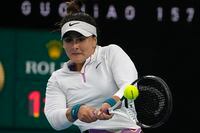 Bianca Andreescu of Canada plays a backhand return during her second round match against Cristina Bucsa of Spain at the Australian Open tennis championship in Melbourne, Australia, Wednesday, Jan. 18, 2023. (AP Photo/Ng Han Guan)