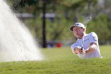 Mackenzie Hughes hits out of a bunker on the 10th green during the second round of the Houston Open golf tournament Friday, Nov. 11, 2022, in Houston. (AP Photo/Michael Wyke)