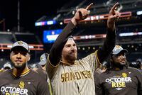 San Diego Padres starting pitcher Joe Musgrove, center, celebrates after the Padres defeated the New York Mets in Game 3 of a National League wild-card baseball playoff series, Sunday, Oct. 9, 2022, in New York. (AP Photo/John Minchillo)