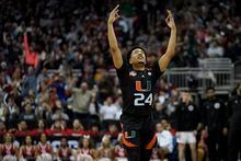 Miami guard Nijel Pack celebrates after scoring against Houston in the second half of a Sweet 16 college basketball game in the Midwest Regional of the NCAA Tournament Friday, March 24, 2023, in Kansas City, Mo. (AP Photo/Charlie Riedel)