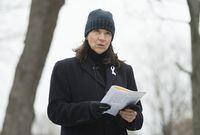 Nathalie Provost, a survivor of the École polytechnique shooting in 1989, reads a poem during an event in Montreal, Sunday, Dec. 6, 2020, on the 31st anniversary of the murder of 14 women in an anti-feminist attack at the university on Dec. 6, 1989. THE CANADIAN PRESS/Graham Hughes