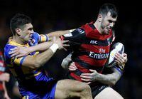 FILE PHOTO: Rugby League - Leeds Rhinos v Warrington Wolves - First Utility Super League - Headingley Carnegie - 4/2/16 Jordan Cox of Warrington Wolves in action with Joel Moon of Leeds Rhinos Action Images via Reuters/Ed Sykes/File Photo