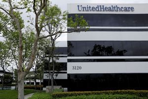 FILE PHOTO: The corporate logo of the UnitedHealth Group appears on the side of one of their office buildings in Santa Ana, California, U.S., April 13, 2020. REUTERS/Mike Blake/File Photo