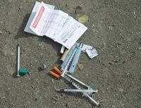 Needles are seen on the ground in Vancouver's Downtown Eastside on March 17, 2020. THE CANADIAN PRESS/Jonathan Hayward