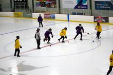 Youth playing broomball at the Tournament of Hope in Thunder Bay, by Ethan Bell