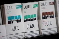 FILE PHOTO: Juul brand vape cartridges are pictured for sale at a shop in Atlanta, Georgia, U.S., September 26, 2019. REUTERS/Elijah Nouvelage/File Photo