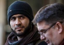 FILE - In this Feb. 26, 2019 photo, former Guantanamo Bay prisoner Omar Khadr and his lawyer Nate Whitling speak with media outside the courthouse in Edmonton, Canada. A Canadian judge ruled on Monday, March 25, 2019 that a war crimes sentence for Khadr expired, meaning he no longer faces the threat of returning to prison.
The Canadian-born Khadr was 15 when he was captured by U.S. troops at a suspected al-Qaida compound in Afghanistan. (Jason Franson/The Canadian Press via AP, File)