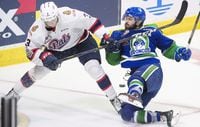 Regina Pats defenceman Libor Hajek (3) fights for control of the puck with WHL Swift Current Broncos forward Tanner Nagel (25) during third period Memorial Cup action in Regina on Wednesday, May, 23, 2018.