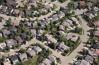 Canada Mortgage and Housing Corp. says the annual pace of housing starts in May was up eight per cent compared with April. An aerial view of housing is shown in Calgary on June 22, 2013. THE CANADIAN PRESS/Jonathan Hayward