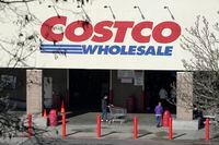 Shoppers walk into a Costco store, Wednesday, March 3, 2021, in Tacoma, Wash. Costco Wholesale Corp. reports earnings results, Thursday, March 4, 2021. (AP Photo/Ted S. Warren)