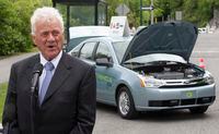 Magna International Chairman Frank Stronach speaks to the media infront of a battery powered car on display in Ottawa Tuesday June 2, 2009.