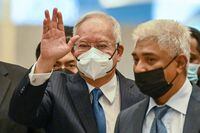 Malaysia's former prime minister Najib Razak waves as he arrives at the federal court in Putrajaya on August 15, 2022. - Malaysia's highest court on August 15 will hear former leader Najib Razak's final bid to overturn his 12-year jail sentence for corruption, with an acquittal potentially clearing the way for his return to power. (Photo by Mohd RASFAN / AFP) (Photo by MOHD RASFAN/AFP via Getty Images)