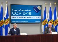 Premier-designate Tim Houston, left, attends his first COVID-19 briefing with Dr. Robert Strang, chief medical officer of health, after the Progressive Conservatives won last week's provincial election, in Halifax on Monday, Aug. 23, 2021. THE CANADIAN PRESS/Andrew Vaughan