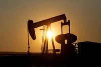FILE PHOTO: An oil pump jack pumps oil in a field near Calgary, Alberta, Canada on July 21, 2014.  REUTERS/Todd Korol