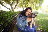 Sonia Datta, who is taking a year off work, is photographed with Chewie, her seven year old Morkie (Maltese Yorkshire Terrier mix) at Toronto’s Music Garden on May 31,2023. (Fred Lum/The Globe and Mail) 