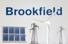 Miniatures of windmill, solar panel and electric pole are seen in front of Brookfield Renewable logo in this illustration taken Jan. 17, 2023.