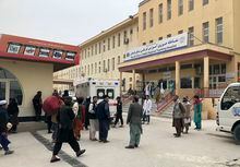 People stand outside a hospital after a bomb blast in Mazar-e Sharif, the capital city of Balkh province, in northern Afghanistan, Thursday, Mar. 9, 2023. A bomb killed a Taliban-appointed provincial governor and two others in Afghanistan's Mazar-e- Sharif Thursday, a Taliban police spokesman said. (AP Photo/Abdul Saboor Sirat)