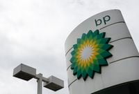 The logo of British Petroleum, BP, adorns a BP petrol station in west London, Tuesday, Aug. 4, 2020. BP said Tuesday it plans to increase spending on low-carbon technology, including renewable energy projects, and says it plans to slash dividends as it reports a second-quarter operating loss and the global oil company prepares for declining sales of fossil fuels. (AP Photo/Alastair Grant)