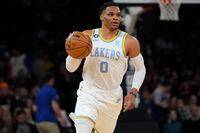 FILE - Los Angeles Lakers' Russell Westbrook brings the ball up during the second half of the team's NBA basketball game against the New York Knicks on Jan. 31, 2023, in New York. The Lakers traded Westbrook to the Utah Jazz and reacquired guard D'Angelo Russell from Minnesota in a three-team, eight-player deal Wednesday night, Feb. 8, ahead of the NBA's trade deadline, a person with knowledge of the trade told The Associated Press. (AP Photo/Frank Franklin II, File)