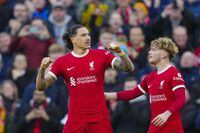 Liverpool's Darwin Nunez, left, celebrates with Liverpool's Harvey Elliott after scoring his side's third goal during the English Premier League soccer match between Liverpool and Burnley, at Anfield stadium in Liverpool, England, Saturday, Feb. 10, 2024. (AP Photo/Jon Super)